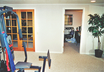 Also looking right, this view shows the French doors that enclose the den. The room on the right is the office/studio. 